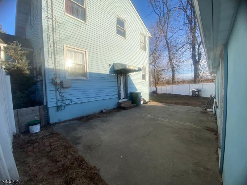 view of side of property featuring a patio area