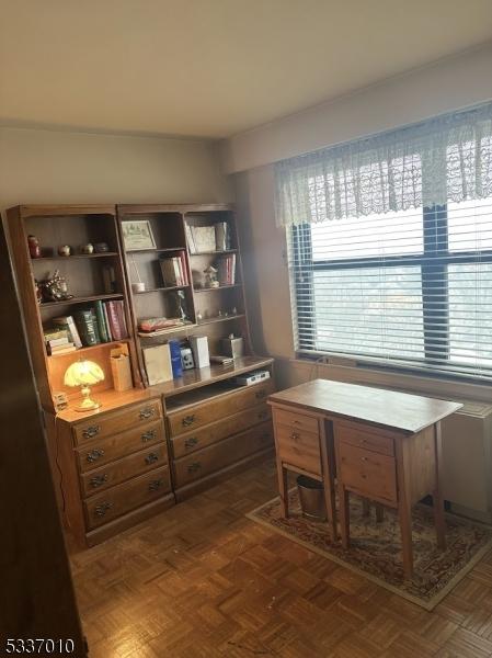 office area with dark parquet flooring