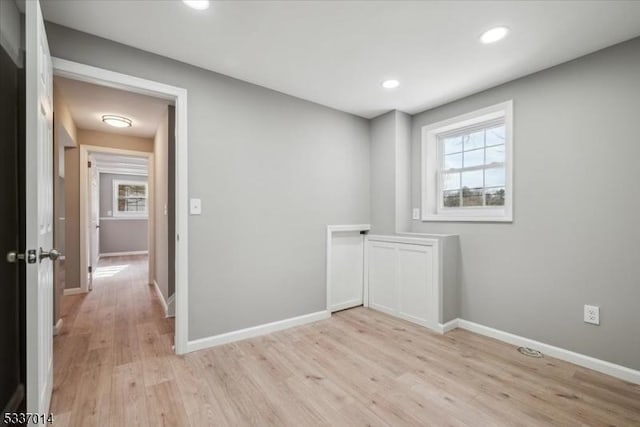 unfurnished room featuring light wood-type flooring