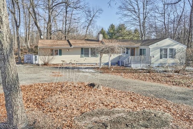 view of front of house featuring a shed