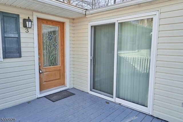 doorway to property with a wooden deck