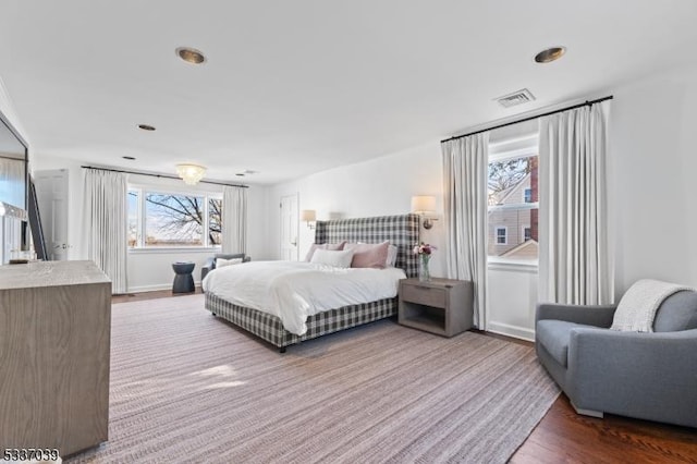 bedroom with hardwood / wood-style floors