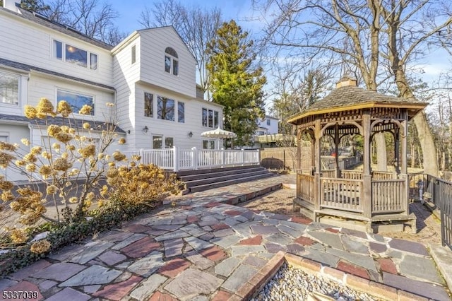 view of community featuring a gazebo and a patio