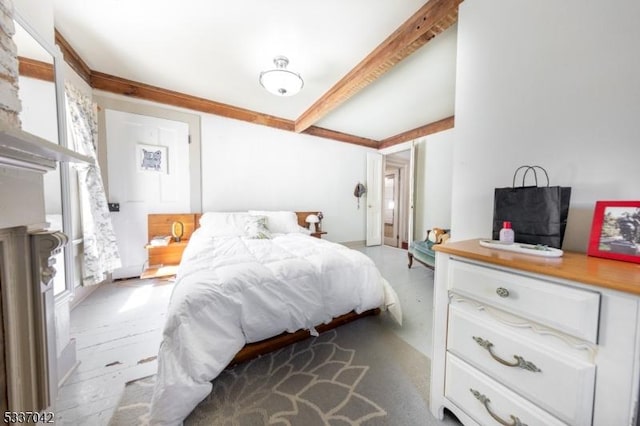 bedroom featuring beamed ceiling