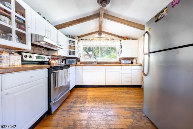 kitchen with lofted ceiling with beams, under cabinet range hood, a sink, white cabinets, and appliances with stainless steel finishes