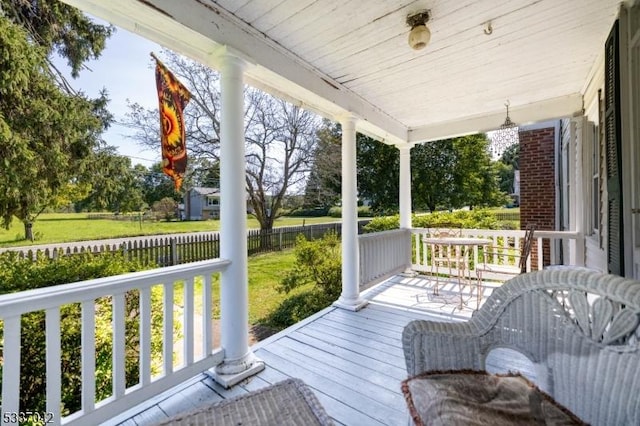 wooden terrace featuring covered porch