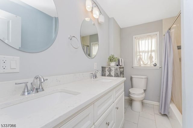 full bathroom featuring vanity, shower / tub combo, and toilet