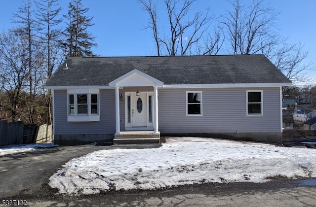 view of front of home featuring roof with shingles