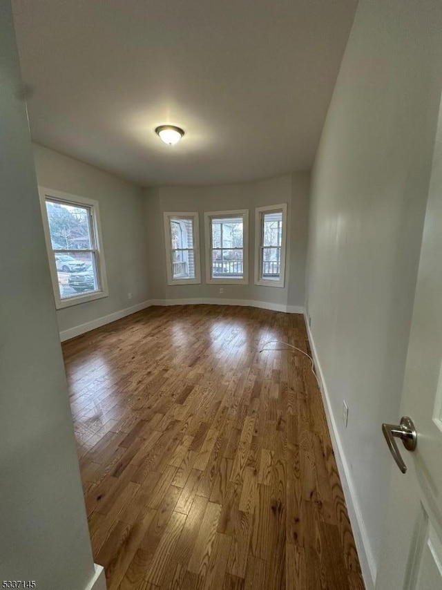 spare room featuring hardwood / wood-style floors