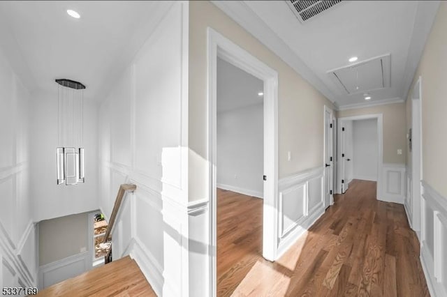 hall with crown molding and dark hardwood / wood-style flooring