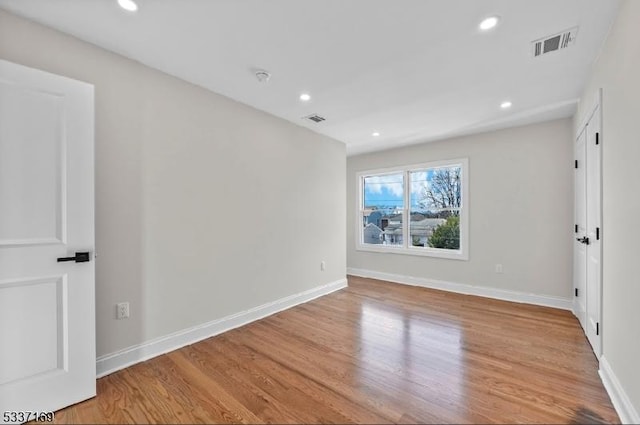 unfurnished room with light hardwood / wood-style flooring