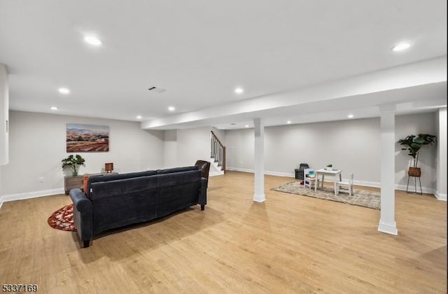 living room with light hardwood / wood-style flooring