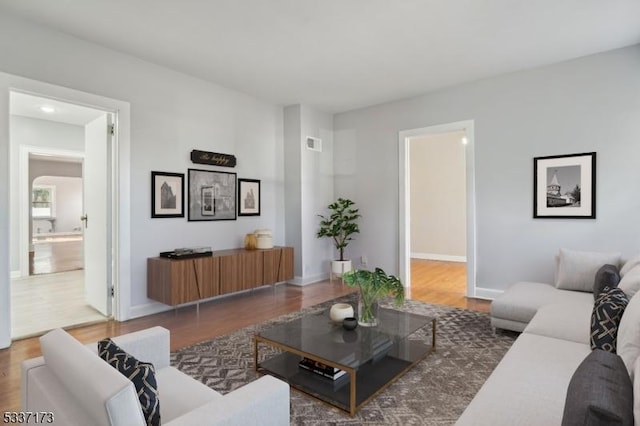 living room featuring dark wood-type flooring