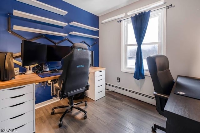 home office with a baseboard radiator and hardwood / wood-style floors