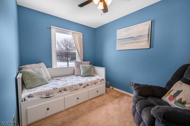 sitting room with light colored carpet and ceiling fan