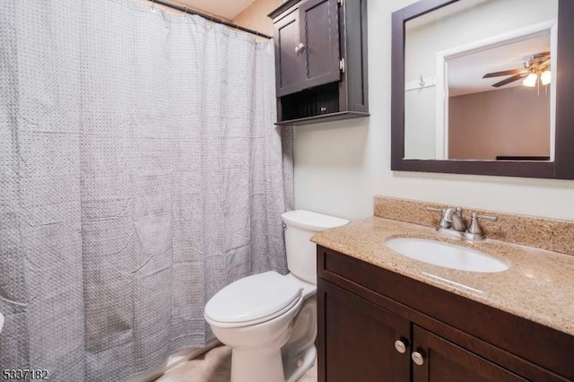 bathroom featuring ceiling fan, vanity, and toilet