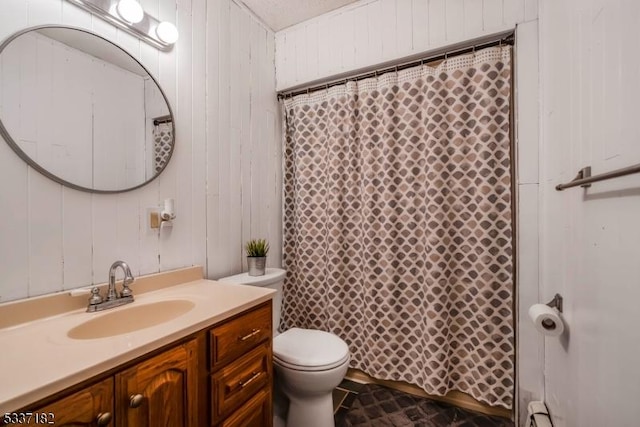 bathroom featuring toilet, vanity, walk in shower, and baseboard heating