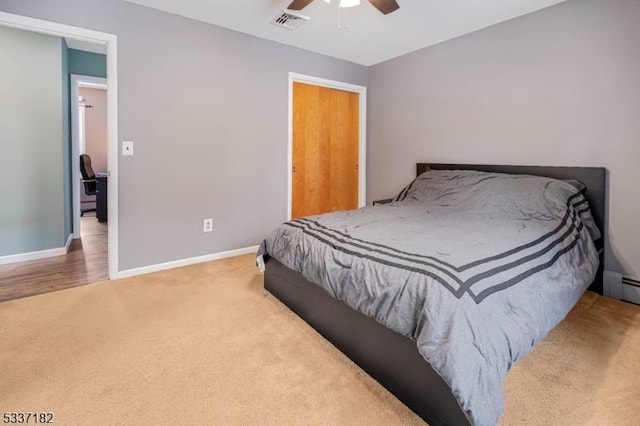 carpeted bedroom featuring ceiling fan