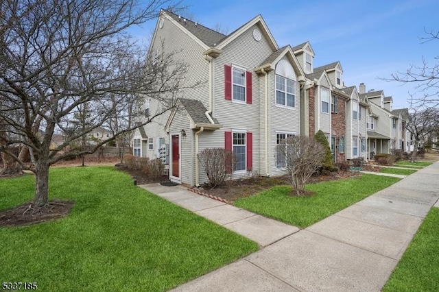 view of front of house featuring a residential view and a front yard