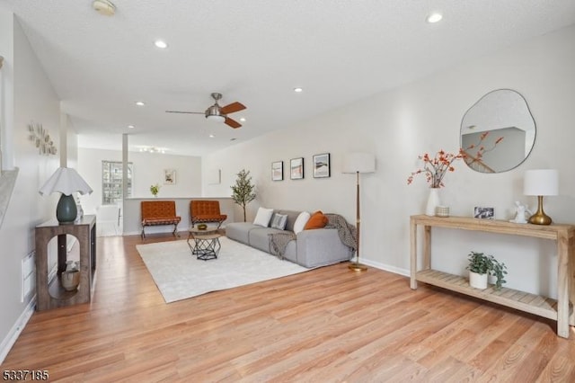 living room with ceiling fan, baseboards, wood finished floors, and recessed lighting