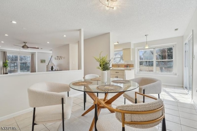 dining room featuring a ceiling fan, light tile patterned floors, recessed lighting, and a textured ceiling