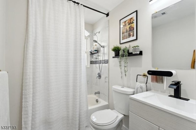 full bathroom with vanity, shower / bath combination with curtain, and toilet