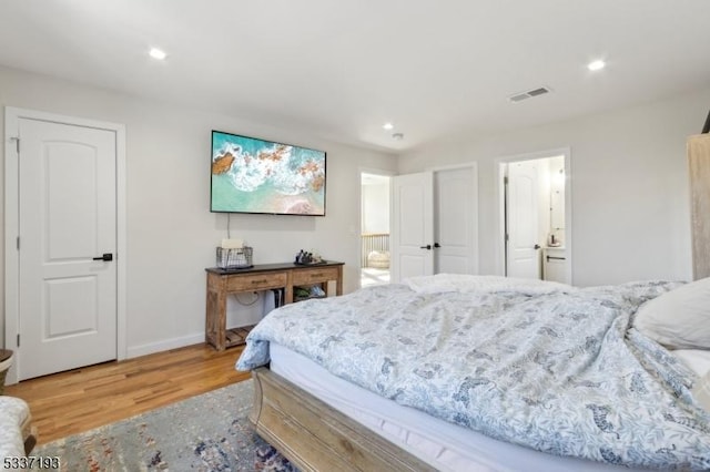 bedroom with hardwood / wood-style floors