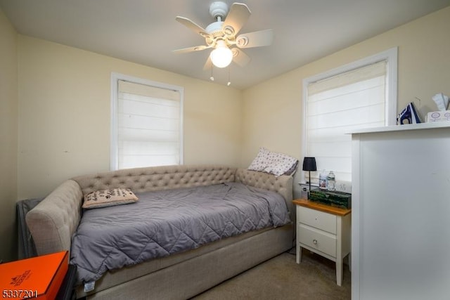 bedroom with ceiling fan and carpet flooring