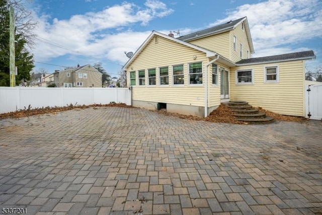 back of property with a patio area