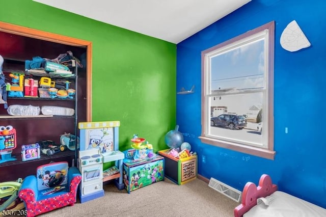 playroom with carpet flooring and visible vents