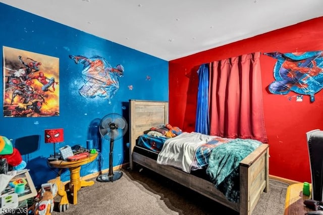 carpeted bedroom featuring baseboards