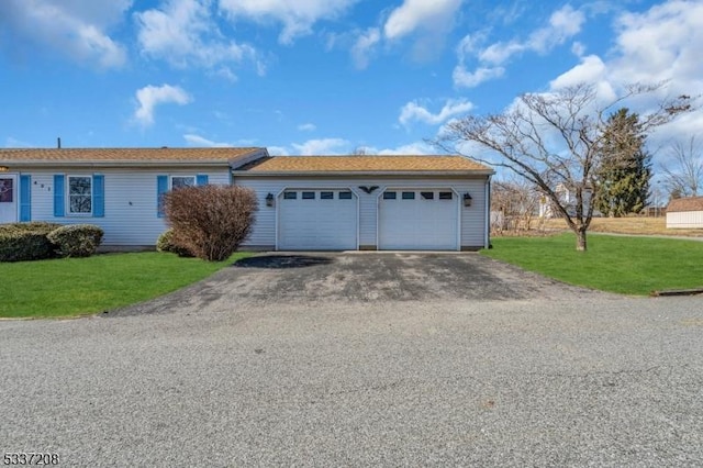 ranch-style home featuring driveway and a front yard