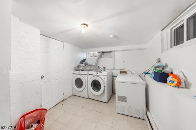 clothes washing area featuring washer and clothes dryer