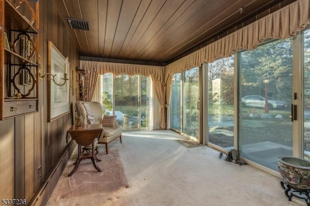 sunroom featuring wood ceiling