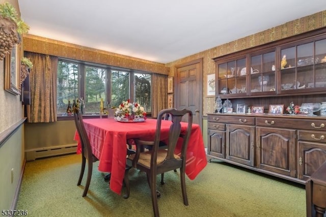 carpeted dining room featuring a baseboard radiator