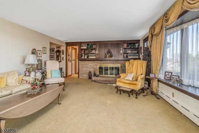 carpeted living room featuring a brick fireplace and a baseboard heating unit