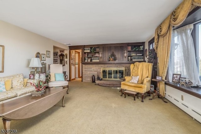 living room featuring a baseboard radiator and carpet