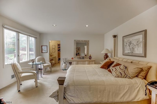 bedroom with light colored carpet