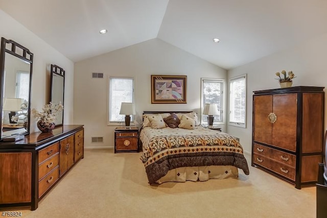 carpeted bedroom featuring lofted ceiling