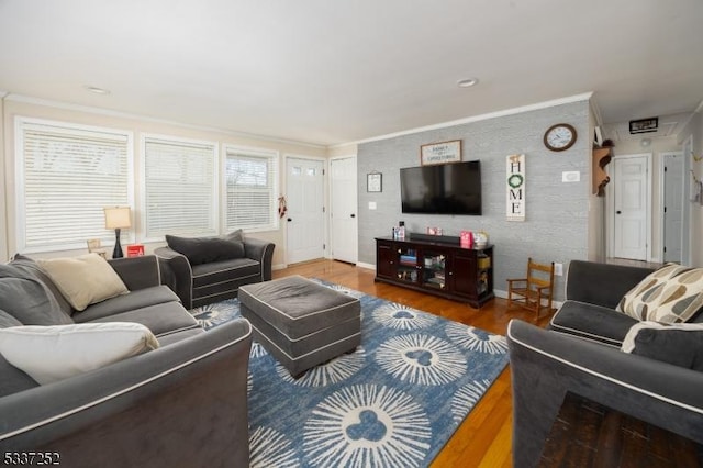 living room featuring crown molding and wood-type flooring