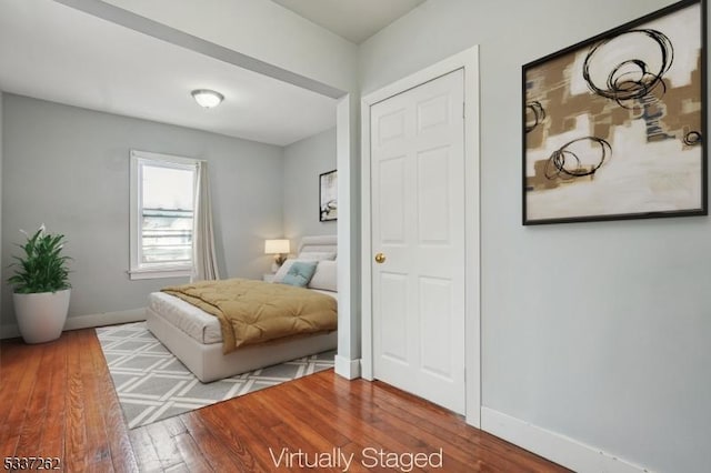 bedroom with hardwood / wood-style floors