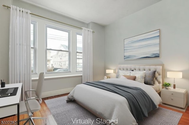 bedroom with light hardwood / wood-style flooring