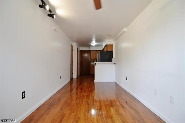 unfurnished living room with light wood-type flooring