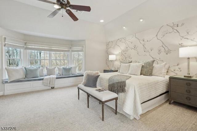 bedroom with ceiling fan and light colored carpet