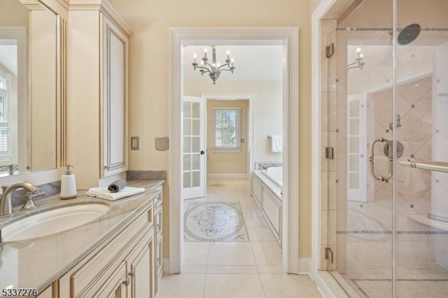 bathroom featuring french doors, vanity, shower with separate bathtub, and tile patterned flooring