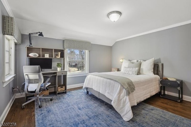 bedroom featuring crown molding, lofted ceiling, and dark hardwood / wood-style flooring