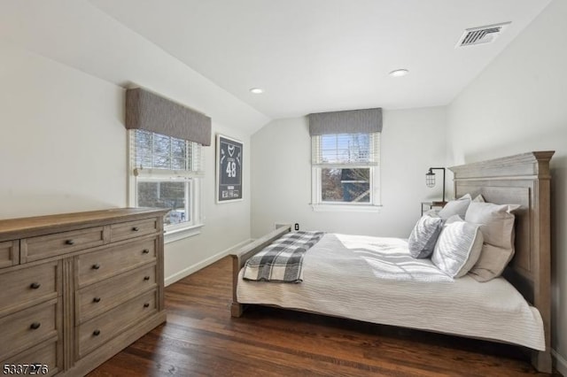 bedroom with dark wood-type flooring and vaulted ceiling