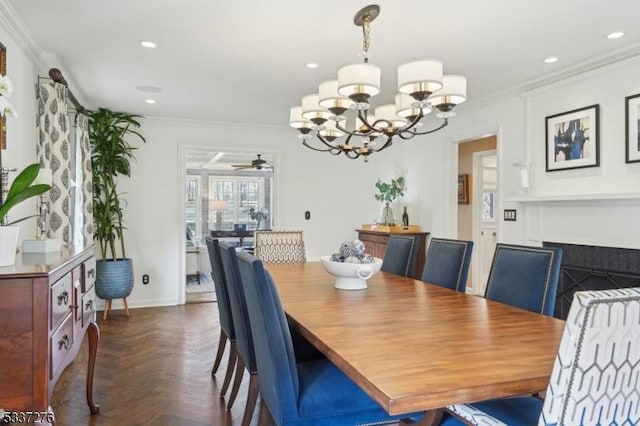 dining area with crown molding, ceiling fan with notable chandelier, and dark parquet floors