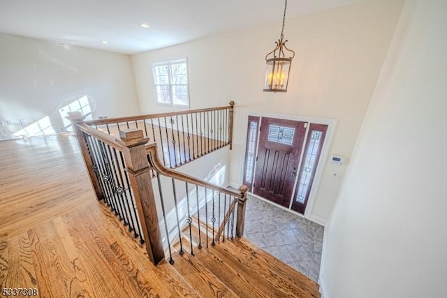 foyer featuring a notable chandelier and light hardwood / wood-style flooring