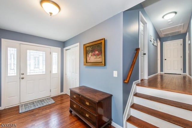 entryway with dark hardwood / wood-style floors